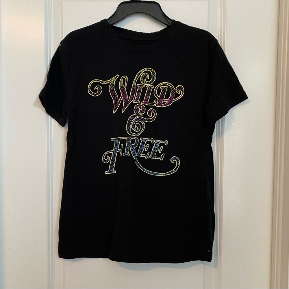 black tee with “wild & free” on the front